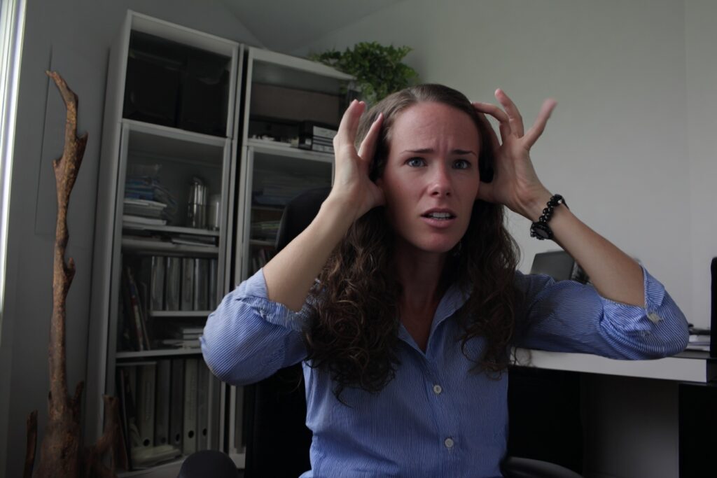neurodivergence in women - female overstimulated at desk at work