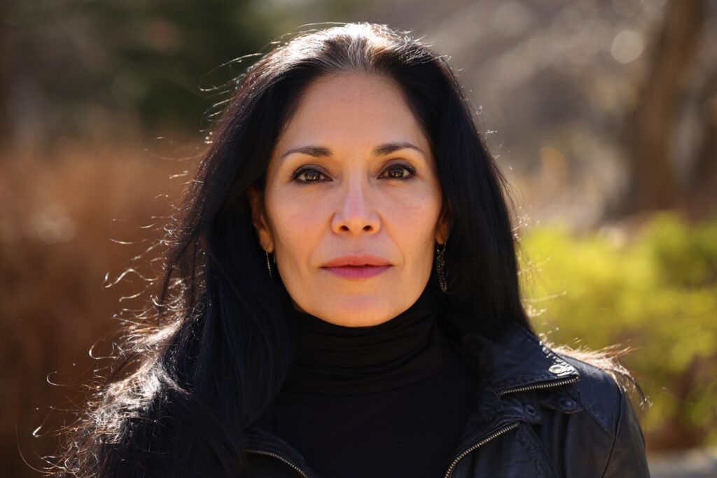 neurodivergent woman in leather jacket with black hair