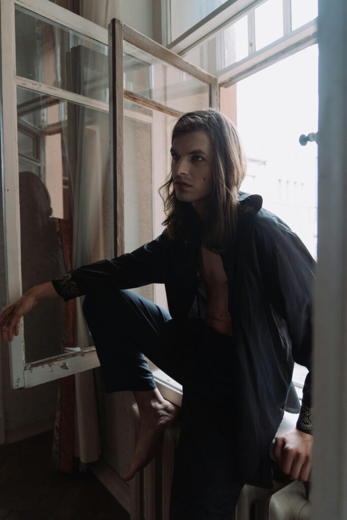 Why Am I Only Attracted to Androgynous People - model sitting in window sill